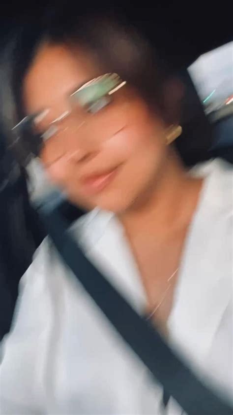 Blurry Selfie In The Parking Lot Big Frame Gold Glasses Gold Hoops White Silk Button Up
