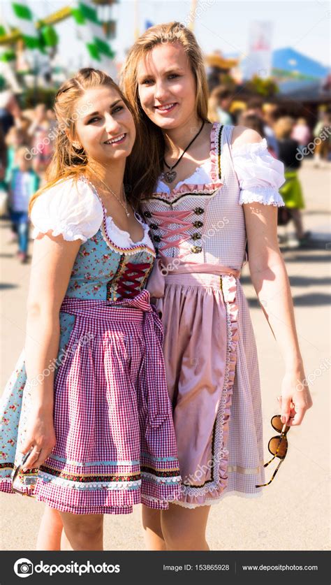 Attractive Young Women At German Funfair Oktoberfest With Traditional