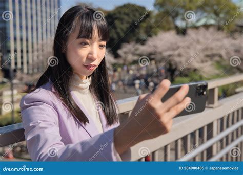 A Portrait Of Selfie By Japanese Woman Behind Cherry Blossom Bust Shot Stock Image Image Of