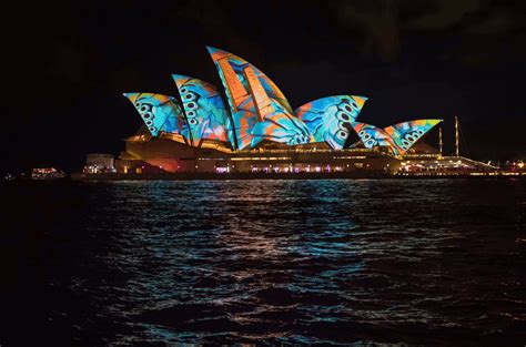 The Sydney Opera House Is Lit Up In Blue And Orange For Vivid Lighting