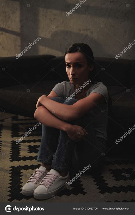 Depressed Woman Hugging Her Knees While Sitting Floor Home Stock Photo By Vitalikradko