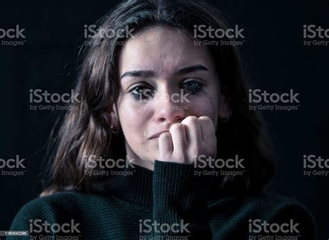 Dramatic Closeup Portrait Of Young Scared Depressed Girl Crying Alone