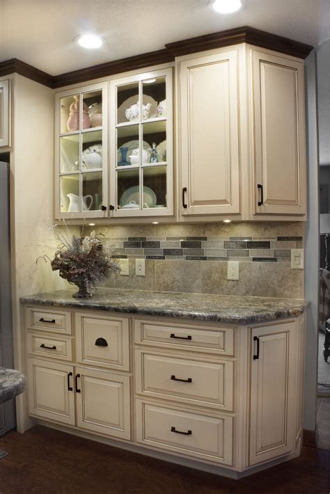 We offer quality, affordability and complimentary personalized kitchen design services. Kitchen with White Distressed Finish and Dark Glaze Accent ...