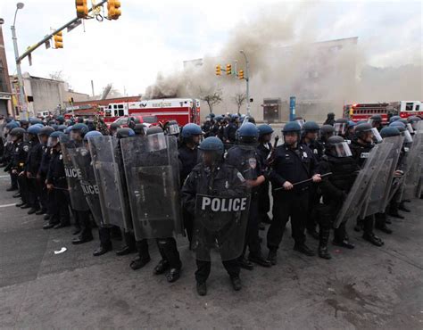 Riot Police Stand Guard Baltimore Burns Riots Engulf The City In