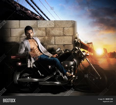Sexy Young Fit Male Model On Motorcycle Outdoors At Dawn Stock Photo