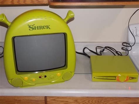 There Is A Small Yellow Computer On The Counter