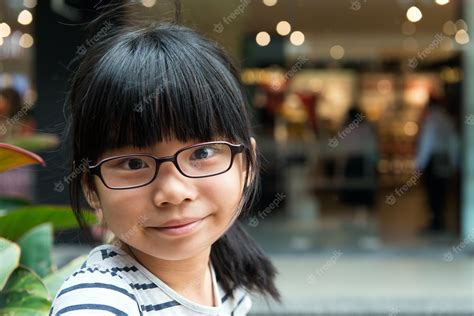 Premium Photo Cute Asian Chinese Girl With Glasses In Park