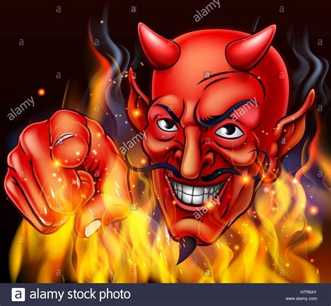 A Devil Surrounded By Flames And Fire Pointing At The Viewer Stock
