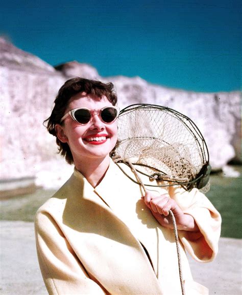 1951 On A Beach With A Net Sunglasses And A Coat Audrey Hepburn Pictures Audrey Hepburn