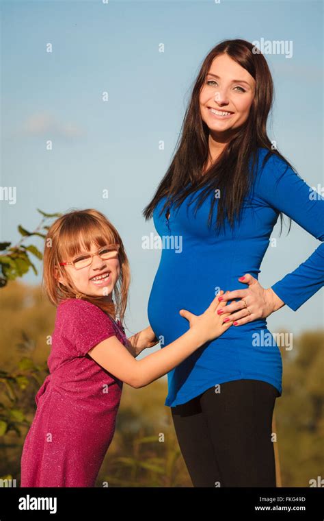 pregnancy motherhood and happiness concept pregnant woman walking outdoor in park her