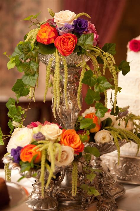 Some couples want their flowers to make a statement, others are happy with something more simple. Apern Vase buffet | Wedding reception flowers, Flower ...