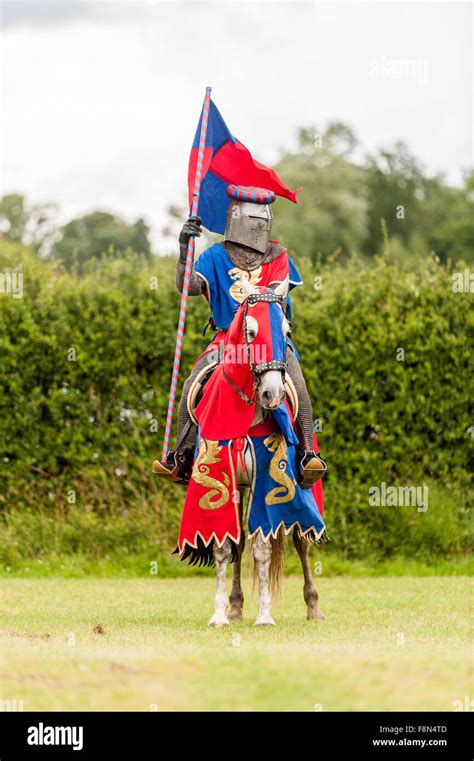 Medieval Knight On A Horse With Flag Stock Photo Alamy