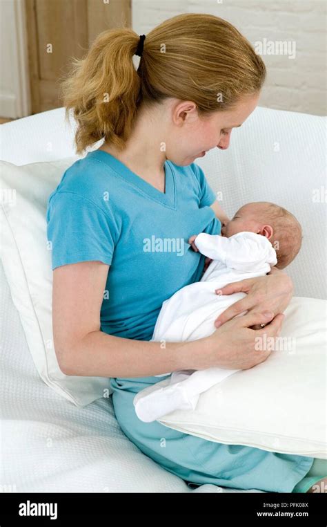 Young Mother Breastfeeding Newborn Baby Boy Stock Photo Alamy