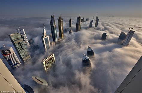 Photos Show Dubai Skyscrapers Piercing Through Fog Daily Mail Online