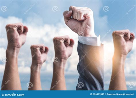 The Abstract Image Of The Hands Rising Up To The Sky Stock Photo