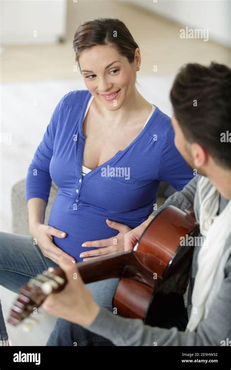 Pregnant Woman Playing Guitar Hi Res Stock Photography And Images Alamy