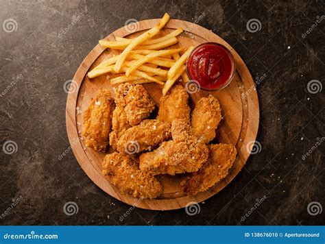 Fried In Breaded Chicken Wings And French Fries Stock Photo Image Of