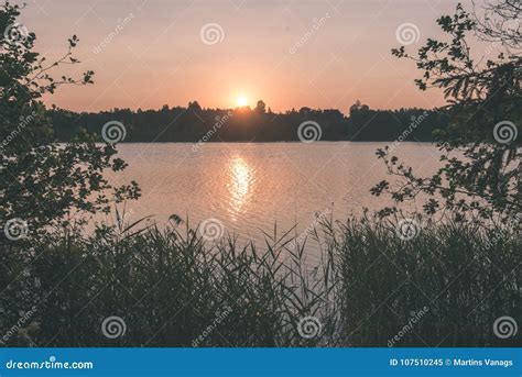 Beautiful Summer Sunset At The Lake With Blue Sky Red And Orang Stock