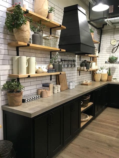 Homeowners are swapping out their upper kitchen cabinets for sleek shelving that puts their dishes on display. Rustic farmhouse fixer upper kitchen. White subway tile ...