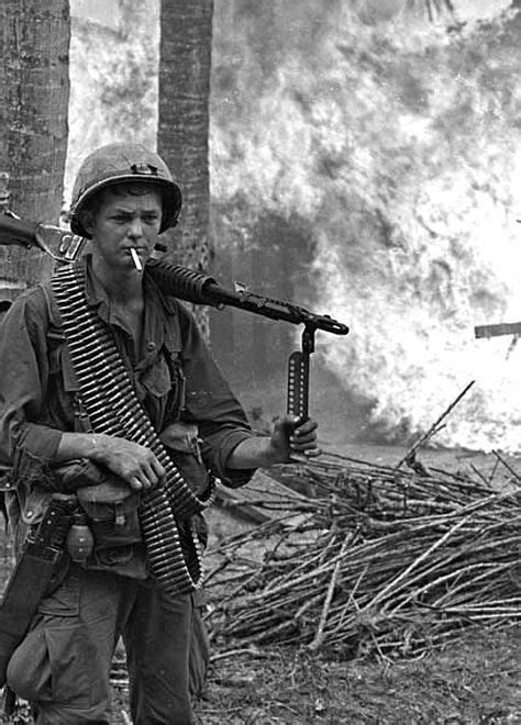 M60 Gunner Posing In Front Of A Burning Village Vietnam War Vietnam