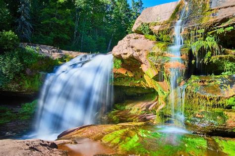 Premium Photo Image Of Waterfalls Up Close With Vibrant Orange Rocks
