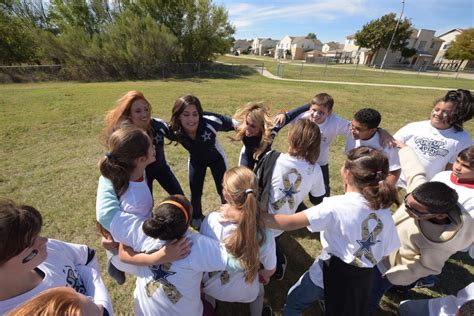 Dallas Cowboys Cheerleaders Youth Coaches Visit Fort Hood School