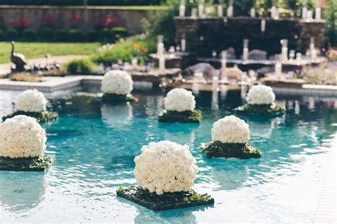 Use faux orchids or your favorite silk flowers from afloral.com for your diy wedding centerpiece. Reception Décor Photos - Manicured Floating Pool Floral ...
