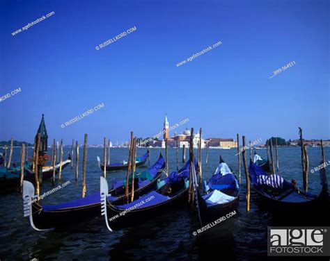 Gondolas And Isola Di San Giorgio Maggiore Venice Italy Stock Photo