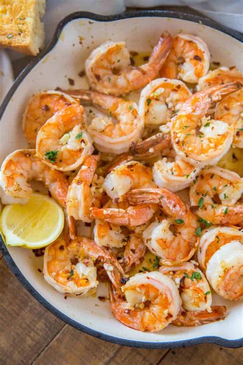 While you cook the pasta, sauté the shrimp with butter and garlic ( at least 3 minced cloves), then add wine. Shrimp Scampi - Dinner, then Dessert