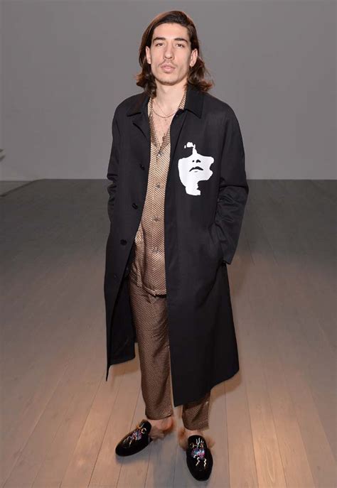 The fit that catapulted bellerins fashion career was a christopher shannon jacket over gold pajamas from zimmermann and embroidered gucci slippers. Hector Bellerin at London Fashion Week 2018 - SoccerBible