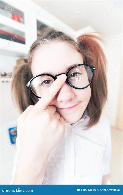 Portrait Of Funny Pretty Nerdy Girl With Ponytails In Glasses Stock