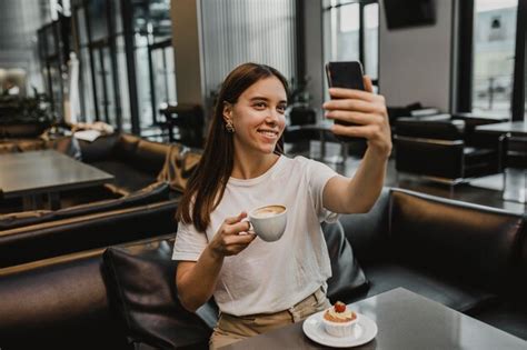 Free Photo Young Woman Taking A Selfie At The Coffee Shop
