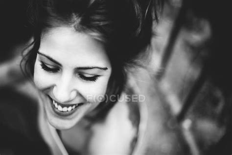 Low Angle Portrait Of Smiling Brunette Girl — Dreamer Sensual Stock