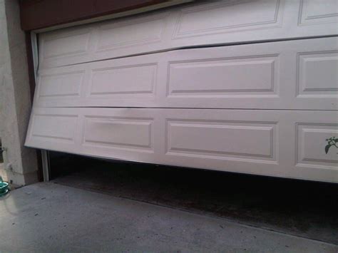 Dented Garage Door Can It Be Fixed The Door House