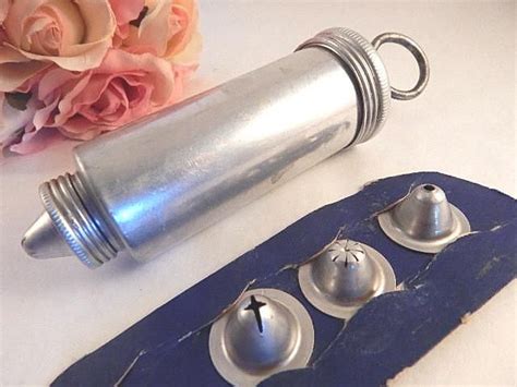 Well you're in luck, because here they come. Cake Decorating Vintage 1940's Aluminum Frosting Press ...