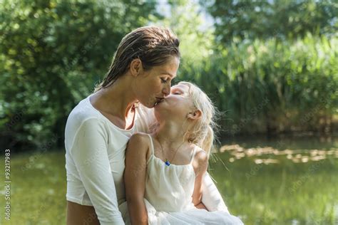 Mother And Daughter Kissing At A Lake Stock Foto Adobe Stock