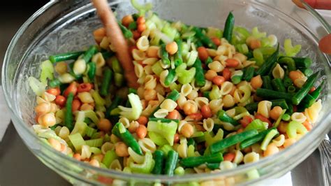 Toss the rice and onion mixture with heirloom cherry tomatoes, chopped cucumbers, vinegar, olive oil, salt, and pepper. martha stewart pasta salad