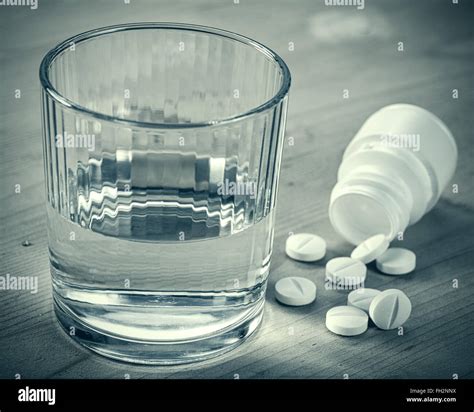 Depression Abstract Medical Backgrounds With Pills And Glass Of Water