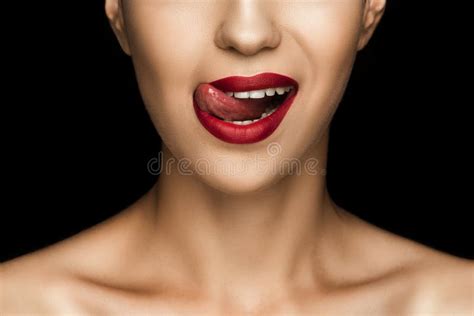 Cropped View Of Beautiful Woman Licking Lips With Red Lipstick Stock
