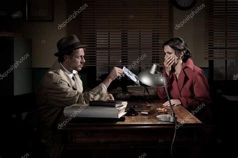 Detective Showing A Picture Woman Stock Photo By ©stokkete 56597015