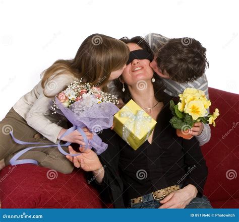Man Kissing Blindfolded Woman In Bed Stock Image