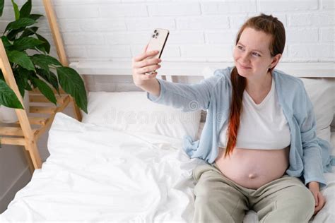 Beautiful Cheerful Pregnant Woman Taking Selfie Photo Using Mobile