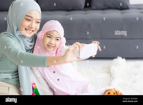 Muslim Mother Future Motherhood In Hijab And Taking Self Portrait In