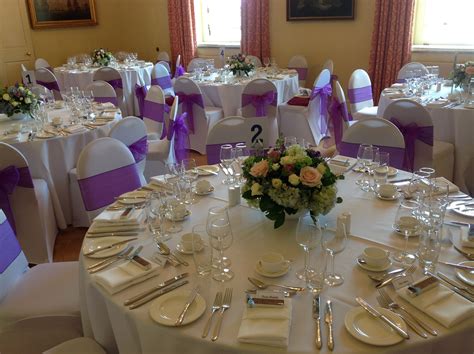 Round banquet or crown top banquet. White chair covers with purple organza sashes | White ...