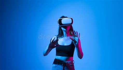 Young Woman Working In Vr Goggles On A Grey Background Modern Architect Using Virtual Reality