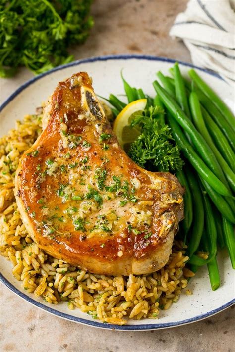 These Baked Pork Chops Are Coated In Garlic And Herb Butter Then Oven