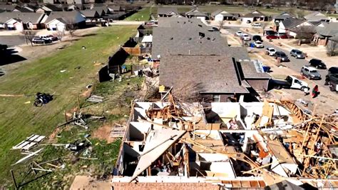 They Assess The Damage Caused By A Devastating Tornado That Hit The
