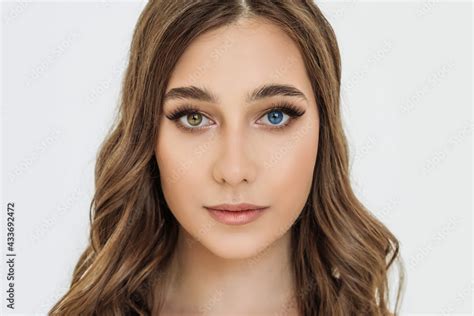 Heterochromia In An Attractive Caucasian Young Woman Face Close Up Portrait Of A Beautiful