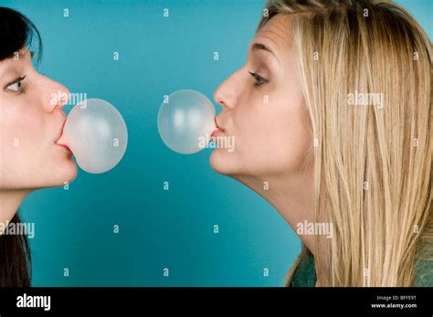 Women Blowing Bubbles With Gum Stock Photo Alamy