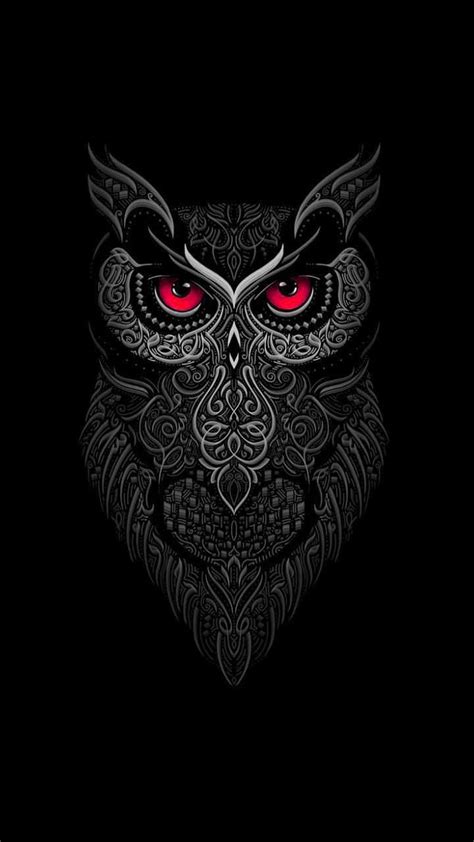 An Owl With Red Eyes And Ornate Patterns On It S Face In The Dark